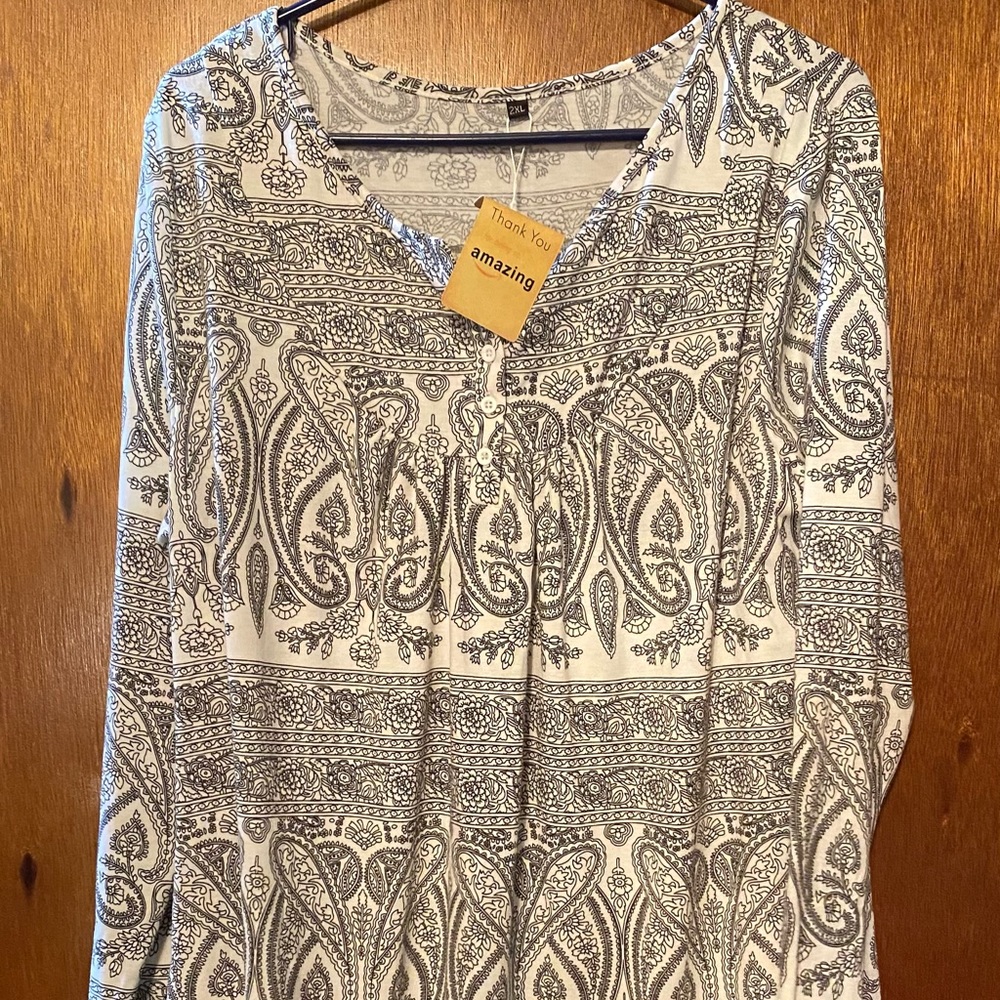 Brand new, size 2x. Fits to size